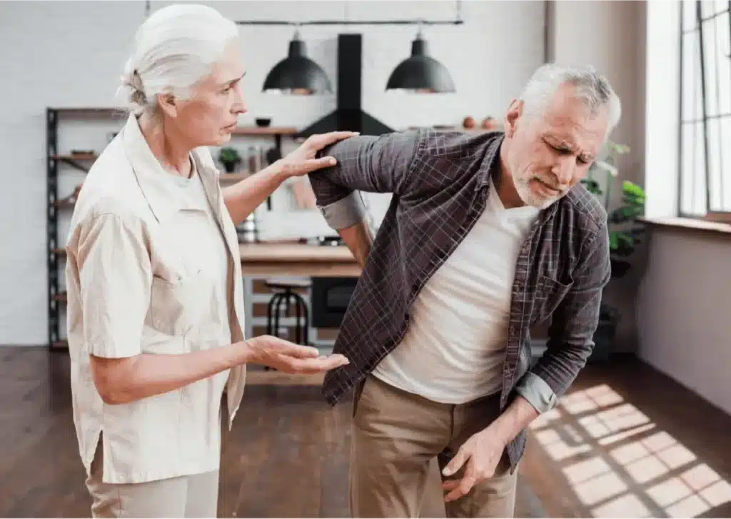 Recognizing the Common Symptoms of Arthritis 8 Elderly couple, with man suffering from back pain.